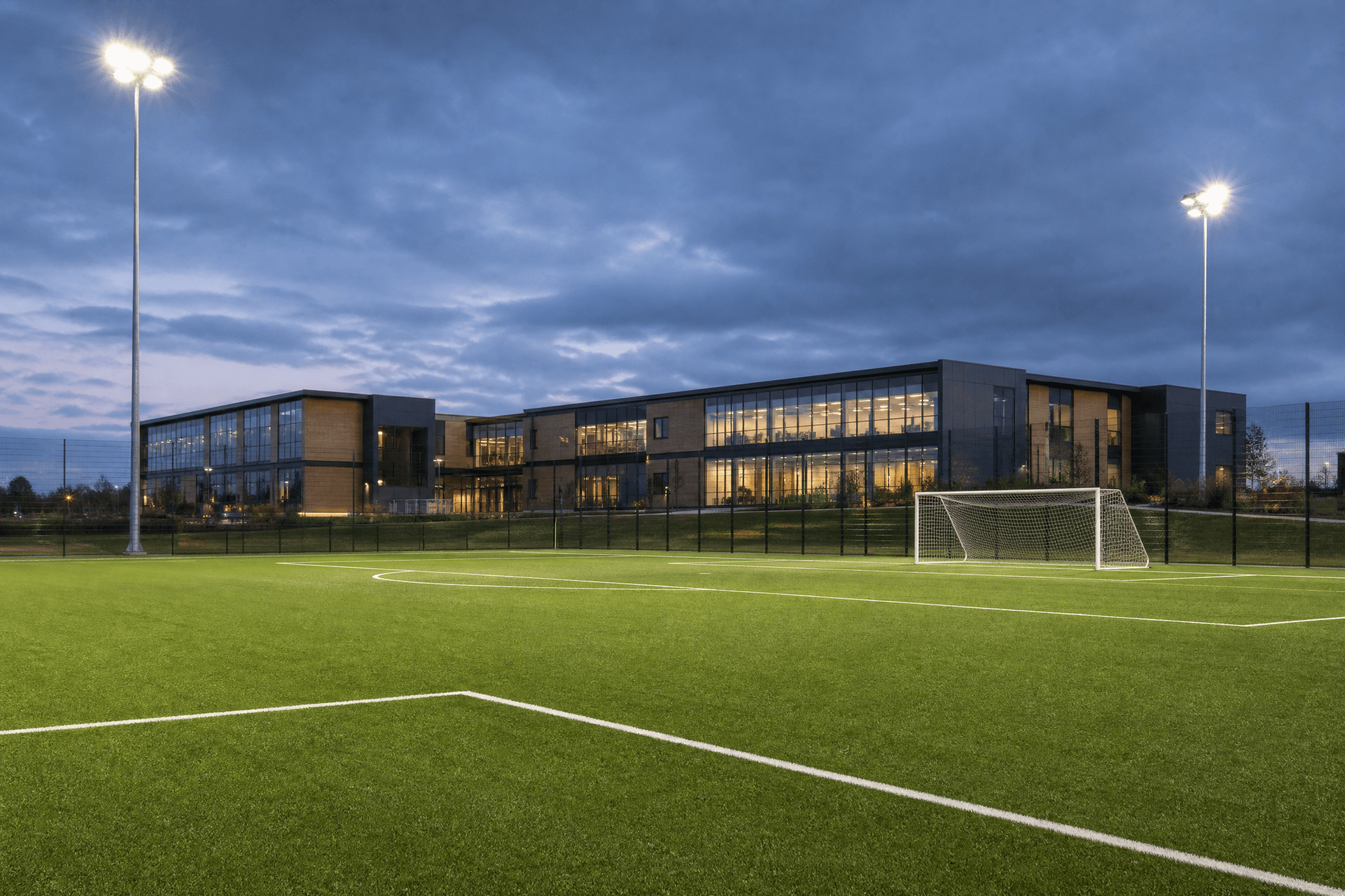 Professionally maintained football field at dusk